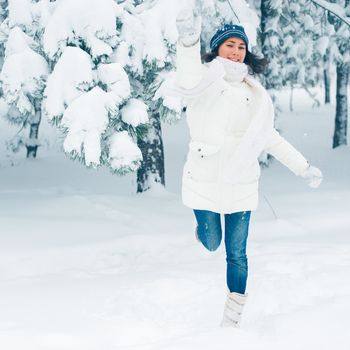 Portrait of beautiful young girl in winter day