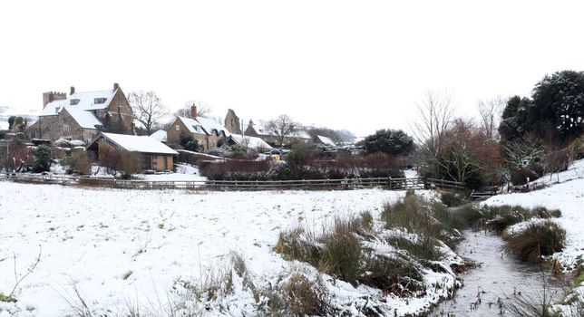 Abbotsbury village covered in snow in rural dorset england