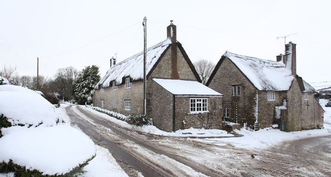 Abbotsbury village covered in snow in rural dorset england