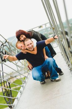 Young family play and  smile each other in the park