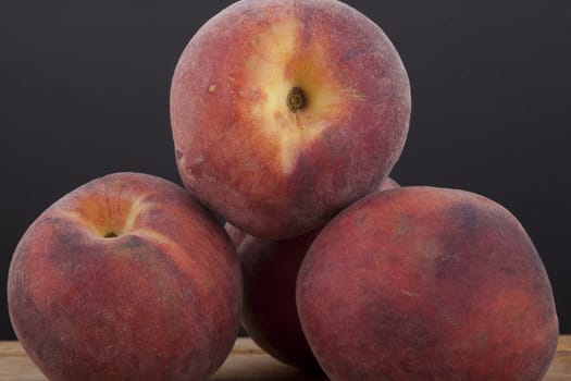 photo of peaches on a black background