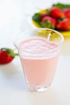Strawberry smoothie with yogurt by fresh strawberries