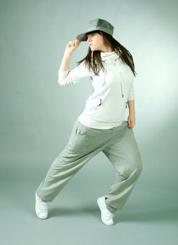 modern style dancer posing on  gray background 