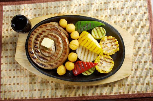 Japanese cuisine .Sausage making roasted with vegetable