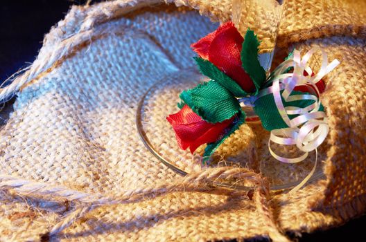 Artificial  red flowers against  the background of baggy fabric