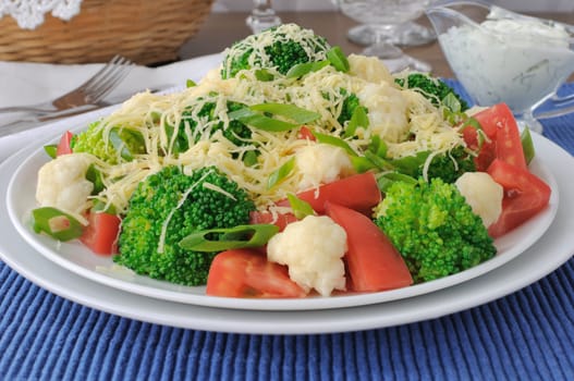 Salad of cauliflower and broccoli, tomatoes and cheese