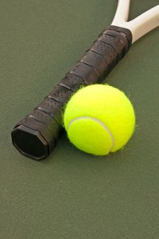 New yellow tennis balls on a green court