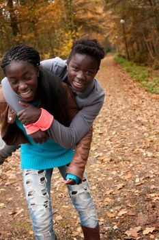 Happy girls in the forest are having fun