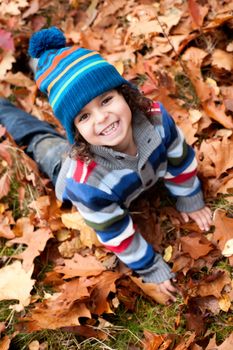 Happy child in the forest is having fun