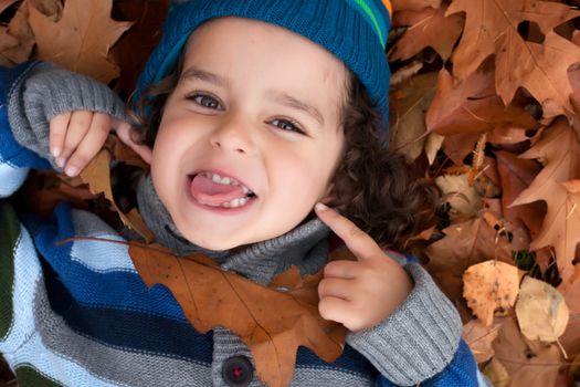 Happy child is having fun in the forest