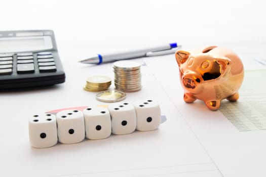 Dices, piggybank, coins stack on business background