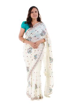 Full body traditional Indian woman in sari costume standing isolated on white background