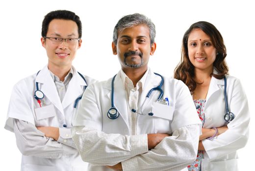 Multiracial doctors / medical team crossed arms standing on white background