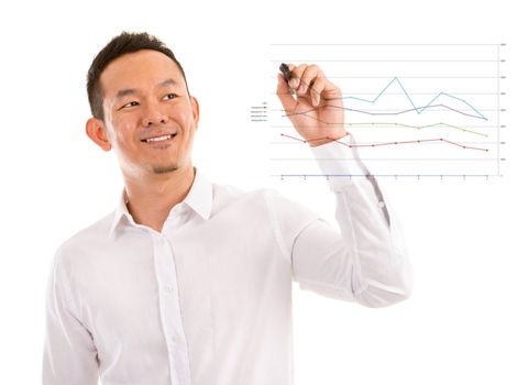 Asian male in white shirt writing something on glass board with marker