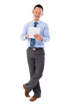 Full body Asian businessman using tablet-pc standing isolated white background