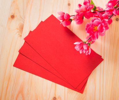 Chinese new year festival decorations, blank red packet or ang pow ready for text.