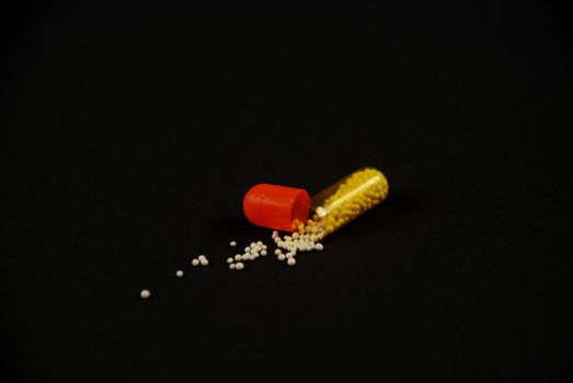 pictures of capsule pills showing the medicine inside it