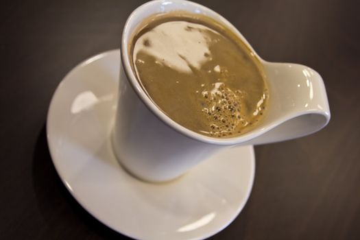 A cup of fresh white coffee