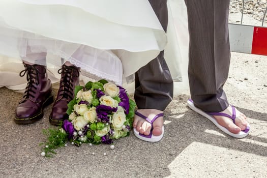 This image shows purple shoes with wedding dress