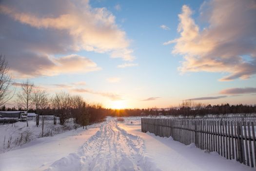 Rural landscape. Winter. Road to the Sun.