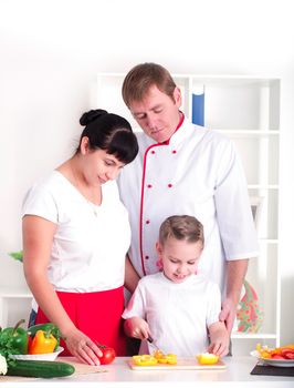 portrait happy family is cooking dinner together