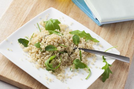 Fresh quinoa salad with herbs and arugula