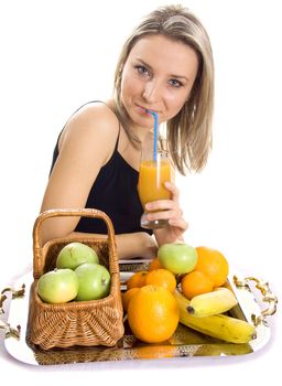 Young smiling woman with fruits. Over white background.
