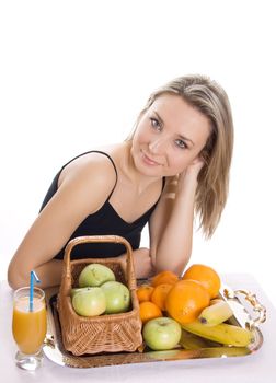 Young smiling woman with fruits. Over white background
