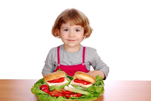 Beauty little girl with sandwiches and vegetables