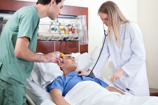 Female doctor checking young patient in hospital