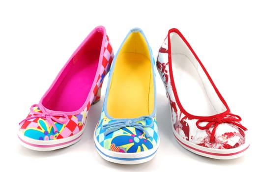 Woman new colorful shoes on white