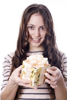 Girl holding a gift in packing