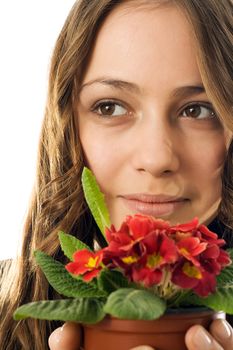 Girl gave the vase with flowers and she was glad gift
