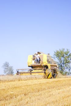 An image of combine harvesting corn
