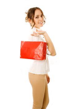 Girl going home carrying shopping bags on her shoulder with happy expression
