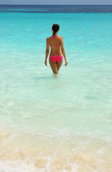 Woman in bikini at tropical beach