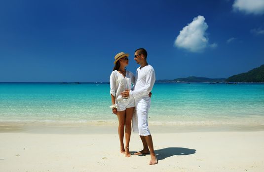 Couple in white on a tropical beach