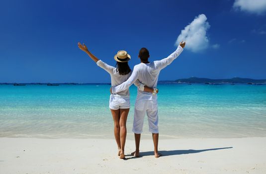 Couple in white on a tropical beach