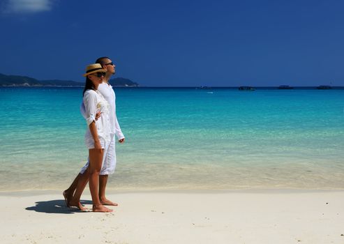 Couple in white on a tropical beach