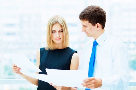 Two young business collegue working together in office