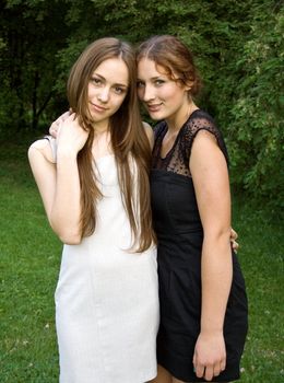 Two young girl friends together on walk