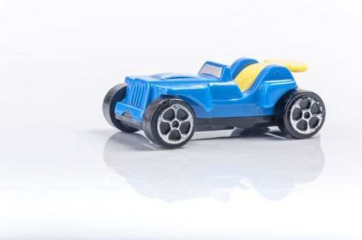 An image of blue toy car isolated on white background