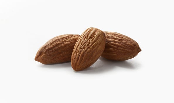Three nuts of almond on the white background