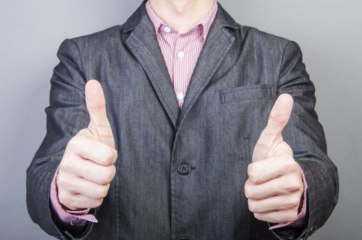 An image of Businessmen handshake  isolated on gray background