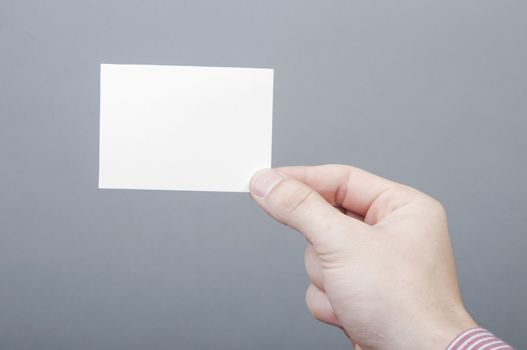 An image of businessmen holding blank card