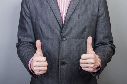 An image of Businessmen handshake  isolated on gray background