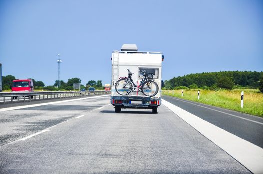 An image of camper on the highway