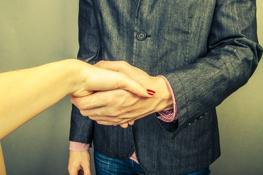An image of Businessmen handshake  isolated on gray background
