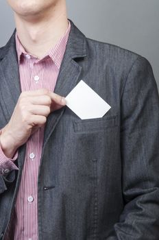 An image of businessmen holding blank card