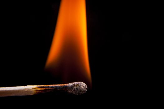 An image of firing match on black background